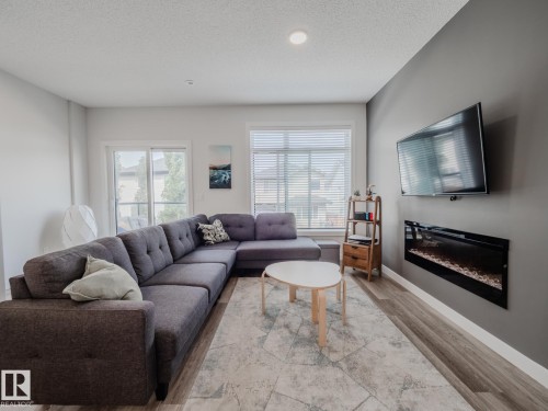 21 1010 Rabbit Hill Road, Edmonton, AB - Indoor Photo Showing Living Room With Fireplace