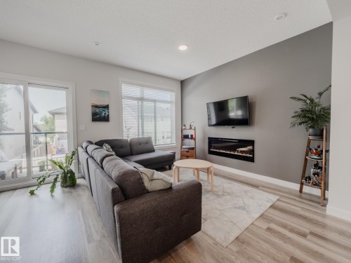 21 1010 Rabbit Hill Road, Edmonton, AB - Indoor Photo Showing Living Room With Fireplace