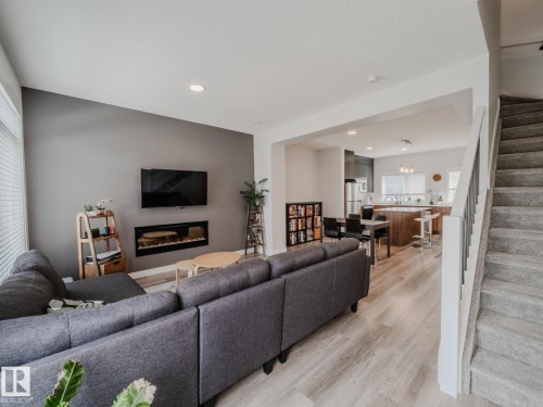 21 1010 Rabbit Hill Road, Edmonton, AB - Indoor Photo Showing Living Room With Fireplace