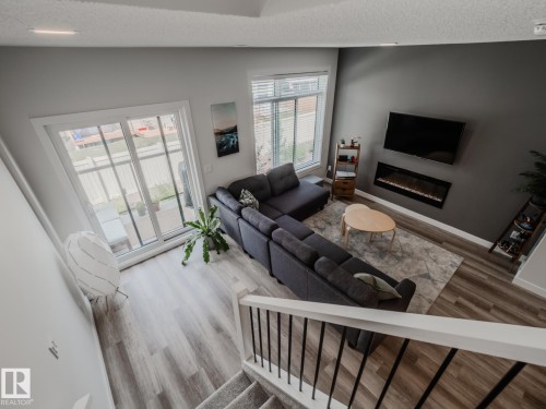21 1010 Rabbit Hill Road, Edmonton, AB - Indoor Photo Showing Living Room With Fireplace