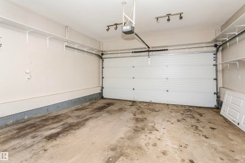 Garage featuring a garage door opener - 607 Windross Crescent, Edmonton, AB - Indoor Photo Showing Garage