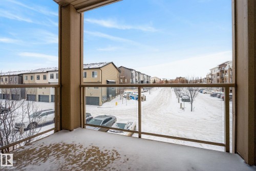 Snow covered patio featuring a balcony - 206 812 Welsh Drive, Edmonton, AB - Outdoor With Balcony With Exterior