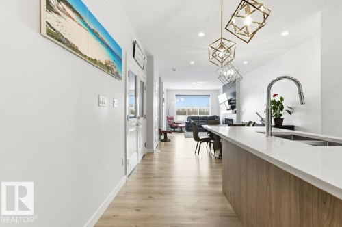 Hallway featuring light wood-style floors and recessed lighting - 8018 Kiriak Link, Edmonton, AB - Indoor Photo Showing Other Room