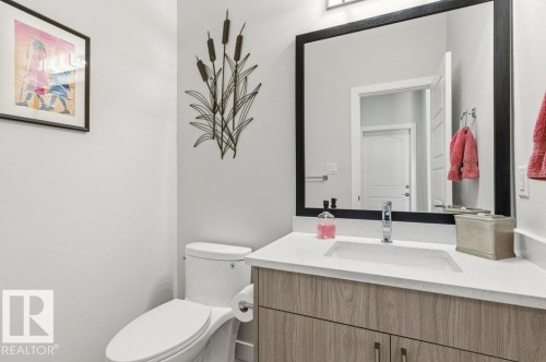 Half bath featuring vanity and toilet - 8018 Kiriak Link, Edmonton, AB - Indoor Photo Showing Bathroom