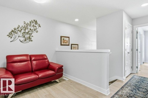 Living area with light wood-type flooring and recessed lighting - 8018 Kiriak Link, Edmonton, AB - Indoor