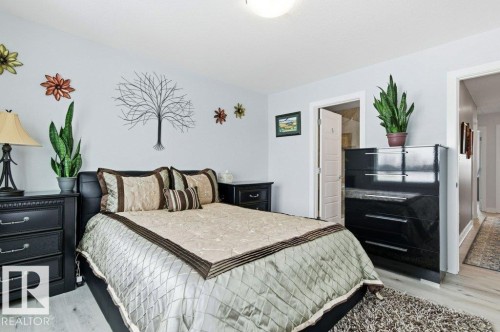Bedroom with light wood-style floors - 8018 Kiriak Link, Edmonton, AB - Indoor Photo Showing Bedroom