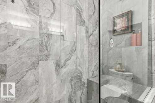 Bathroom with a marble finish shower - 8018 Kiriak Link, Edmonton, AB - Indoor Photo Showing Bathroom