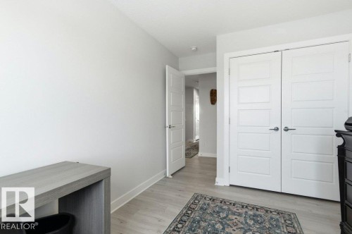 Bedroom featuring light wood-style flooring - 8018 Kiriak Link, Edmonton, AB - Indoor