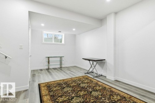 Basement featuring light wood-style floors and recessed lighting - 8018 Kiriak Link, Edmonton, AB - Indoor Photo Showing Other Room