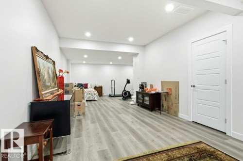 Rec Room in Basement with light wood-style flooring and recessed lighting - 8018 Kiriak Link, Edmonton, AB - Indoor Photo Showing Other Room