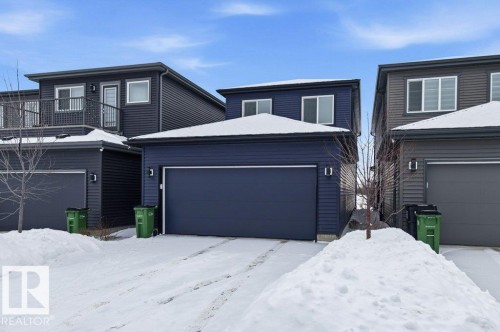 View of back of property featuring an attached garage - 8018 Kiriak Link, Edmonton, AB - Outdoor