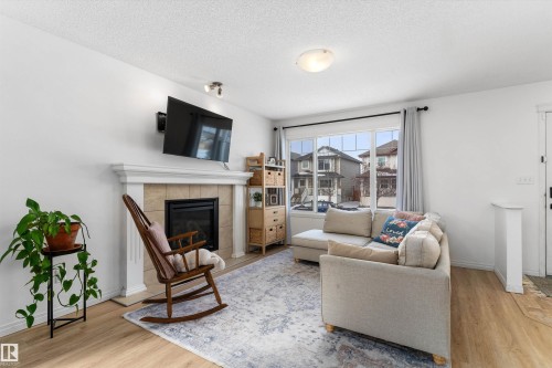 419 Songhurst Place, Leduc, AB - Indoor Photo Showing Living Room With Fireplace