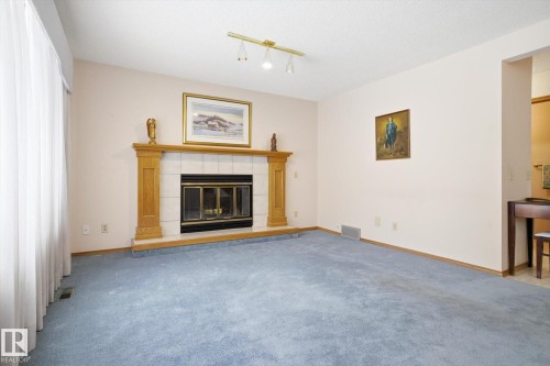 1 Heritage Boulevard, St. Albert, AB - Indoor Photo Showing Living Room With Fireplace