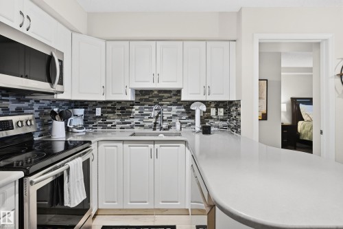 703 10649 Saskatchewan Drive, Edmonton, AB - Indoor Photo Showing Kitchen With Double Sink