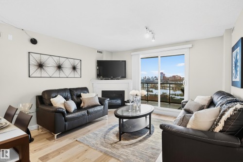 703 10649 Saskatchewan Drive, Edmonton, AB - Indoor Photo Showing Living Room With Fireplace