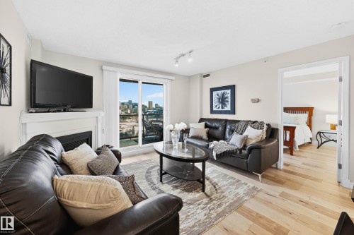 703 10649 Saskatchewan Drive, Edmonton, AB - Indoor Photo Showing Living Room With Fireplace