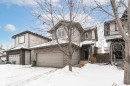 View of front facade with stone siding and an attached garage - 115 57 Street, Edmonton, AB  - Outdoor With Facade 