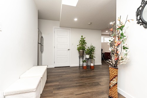Hallway featuring dark wood-style flooring, a skylight, and recessed lighting - 115 57 Street, Edmonton, AB - Indoor Photo Showing Other Room