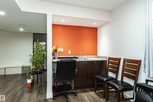 Office with dark wood-type flooring, recessed lighting, and wet bar - 115 57 Street, Edmonton, AB - Indoor
