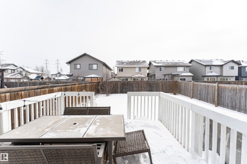 Wooden terrace with a residential view, a fenced backyard, and outdoor dining area - 115 57 Street, Edmonton, AB - Outdoor With Deck Patio Veranda With Exterior