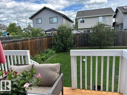 Fenced backyard with a residential view and a wooden deck - 115 57 Street, Edmonton, AB - Outdoor
