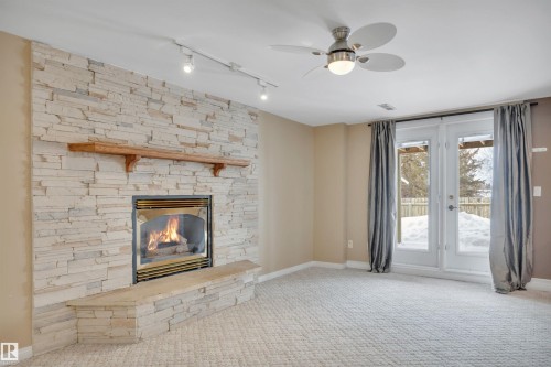 3948 62 Street, Edmonton, AB - Indoor Photo Showing Living Room With Fireplace