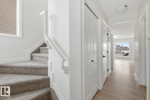 Staircase with wood finished floors - 73 Keystone Crescent Crescent, Leduc, AB - Indoor Photo Showing Other Room