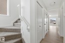 Staircase with wood finished floors - 73 Keystone Crescent Crescent, Leduc, AB  - Indoor Photo Showing Other Room 