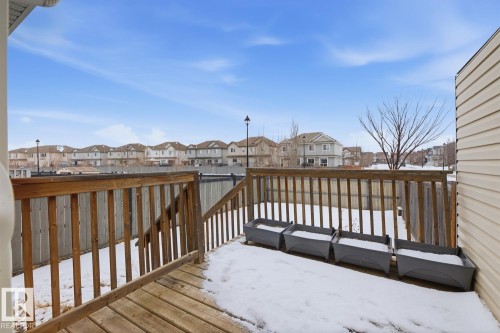 Snow covered deck featuring a residential view - 73 Keystone Crescent Crescent, Leduc, AB - Outdoor With Exterior