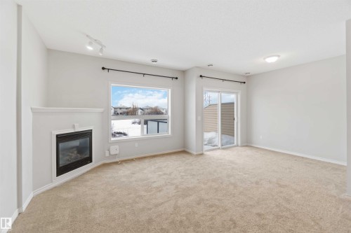 53 3010 33 Avenue, Edmonton, AB - Indoor Photo Showing Living Room With Fireplace