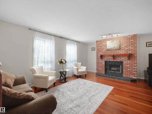 6217 13 Avenue, Edmonton, AB - Indoor Photo Showing Living Room With Fireplace