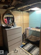 Bedroom featuring wooden walls - 