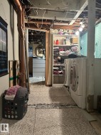 Unfinished below grade area featuring independent washer and dryer - 