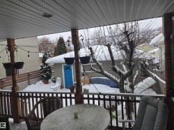 Snow covered deck with outdoor dining space - 