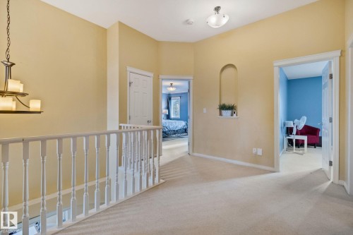 Hallway with light carpet and baseboards - 502 Westerra Boulevard, Stony Plain, AB - Indoor Photo Showing Other Room
