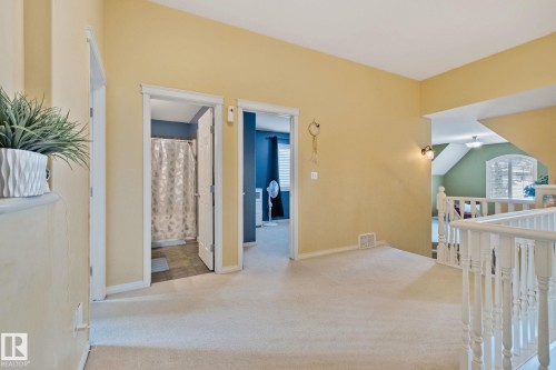 Corridor with light colored carpet and an upstairs landing - 502 Westerra Boulevard, Stony Plain, AB - Indoor Photo Showing Other Room