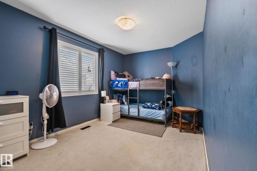 Bedroom featuring light colored carpet and a textured ceiling - 502 Westerra Boulevard, Stony Plain, AB - Indoor Photo Showing Other Room