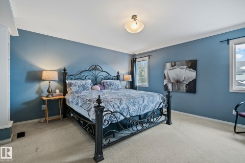 Bedroom with crown molding and light carpet - 502 Westerra Boulevard, Stony Plain, AB - Indoor Photo Showing Bedroom