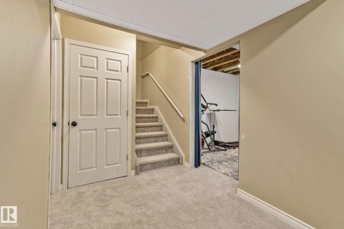 Stairway featuring carpet flooring and baseboards - 502 Westerra Boulevard, Stony Plain, AB - Indoor Photo Showing Other Room