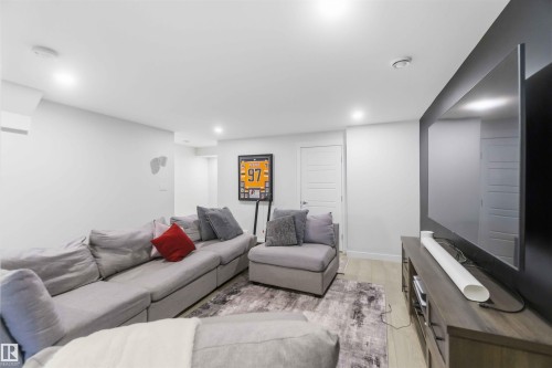 Living room featuring light wood-style floors and recessed lighting - 2331 71 Street, Edmonton, AB - Indoor