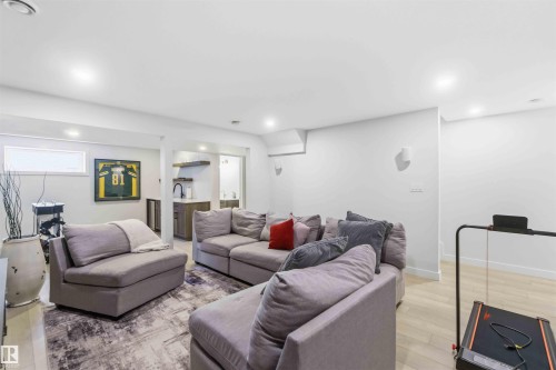 Living area featuring light wood-style flooring and recessed lighting - 2331 71 Street, Edmonton, AB - Indoor