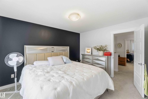 Bedroom with baseboards and light colored carpet - 2331 71 Street, Edmonton, AB - Indoor Photo Showing Bedroom