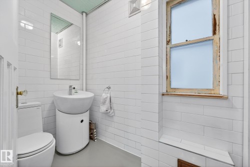 Bathroom featuring vanity and tile walls - 10523 127 Street, Edmonton, AB - Indoor Photo Showing Bathroom