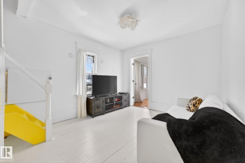 Living area featuring light wood-type flooring - 10523 127 Street, Edmonton, AB - Indoor