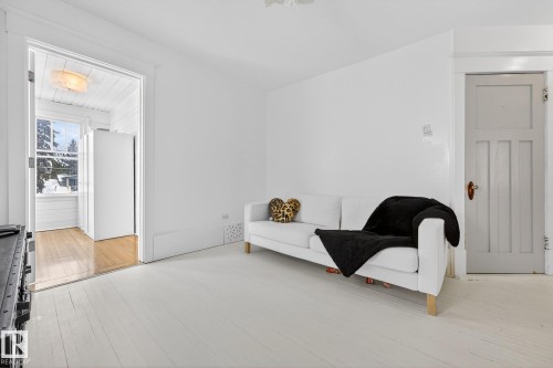 Sitting room featuring light wood finished floors - 10523 127 Street, Edmonton, AB - Indoor Photo Showing Other Room