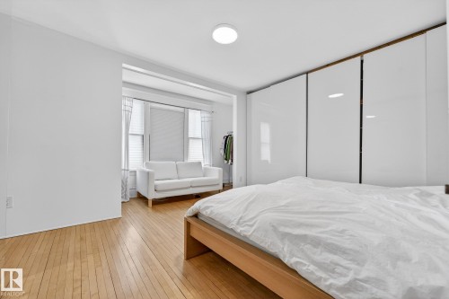 Bedroom with light wood-type flooring - 10523 127 Street, Edmonton, AB - Indoor Photo Showing Bedroom