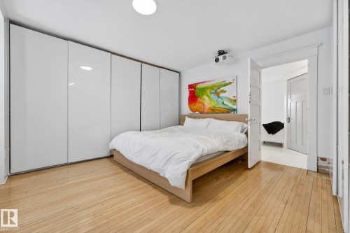 Bedroom with light wood-style flooring - 10523 127 Street, Edmonton, AB - Indoor Photo Showing Bedroom