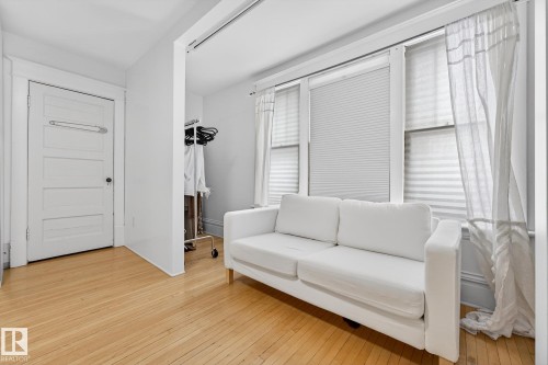 Sitting room featuring light wood-style flooring - 10523 127 Street, Edmonton, AB - Indoor
