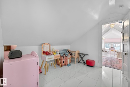 Recreation room featuring lofted ceiling - 10523 127 Street, Edmonton, AB - Indoor