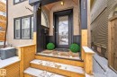 Entrance to property with stucco siding and a wooden deck - 10523 127 Street, Edmonton, AB  - Outdoor With Exterior 